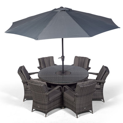 Karas 6 - Person Wicker Patio Dining Set with Round Table , Cushions Included