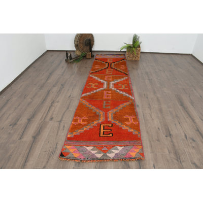 Tapis géométrique orange en laine 33,1 x 121,3 po
