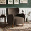Fauteuil club à oreilles rembourré