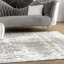 Tapis performance gris / blanc moderne à motif abstrait tissé à la machine Deedra-79593280