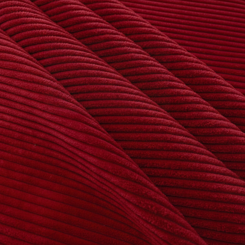 Repose-pieds rembourré en velours côtelé