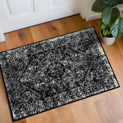 Tapis noir ivoire rétro à médaillon
