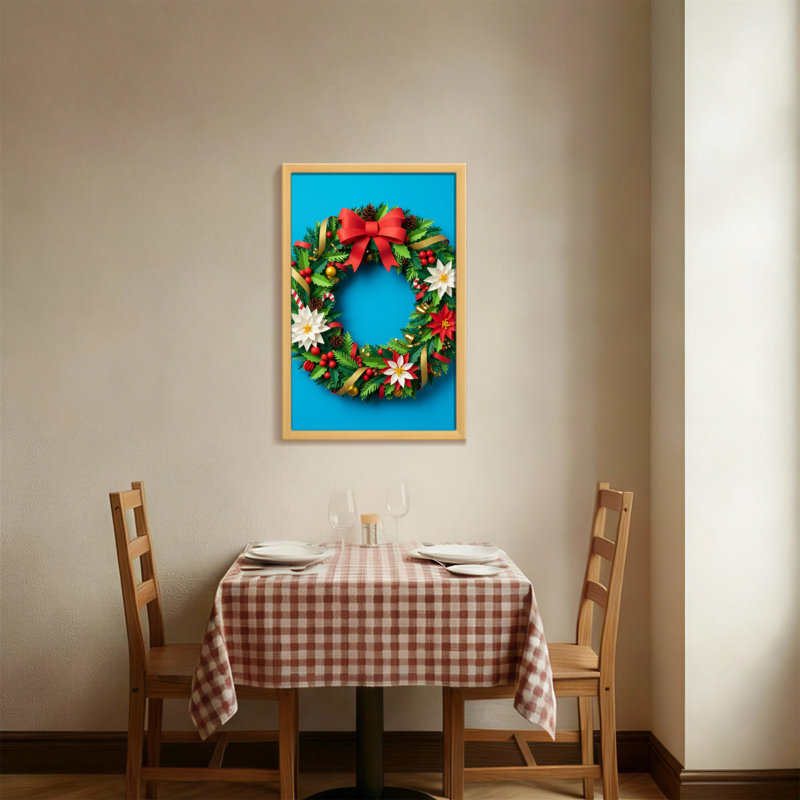 Couronne de Noël avec un arc rouge et des fleurs, H 18 po x l 12 po