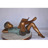 Kid On A Pillow Reading A Book Bronze Statue - Size: 32"L X 13"W X 12"H.