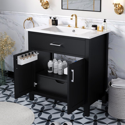 Meuble-lavabo noir de 30 po avec lavabo en céramique et grande capacité de rangement. Fabriqué en bois massif robuste. Comprend un tiroir à tablettes polyvalent. Conception élégante pour une unité. Mécanisme de fermeture en douceur