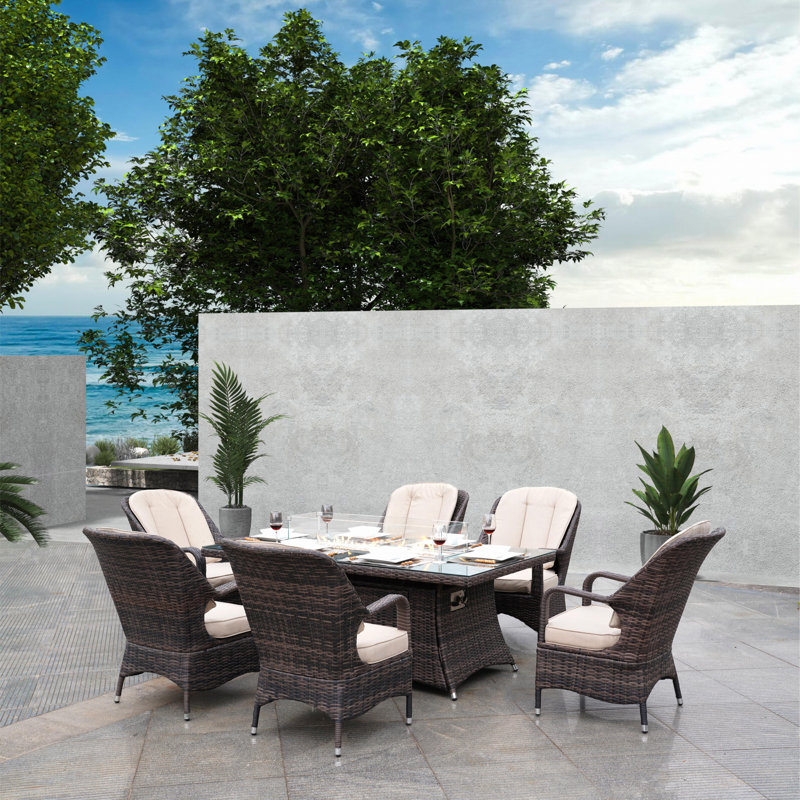 Ahders 6 - Person Wicker Patio Dining Set with Rectangular Table , Cushions Included, Brown