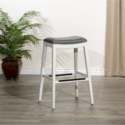 Tabouret de selle, finition patinée, siège en cuir