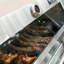 Barbecue au gaz en acier inoxydable avec brûleur latéral et rôtissoire à 4 brûleurs au propane liquide Mesa 405K de Monument Grills Mesa 405K