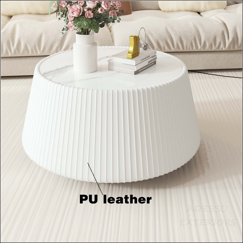 Table basse ronde avec plateau en pierre frittée et base en microfibre