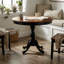 Ensemble de salle à manger rond 3 pièces en bois d'hévéa antique couleur cerisier noir, avec pied central et dossier à barreaux.