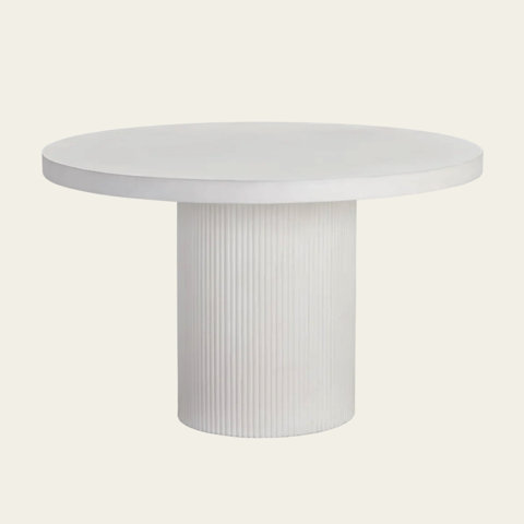 A white round table with a ridged pillar base.