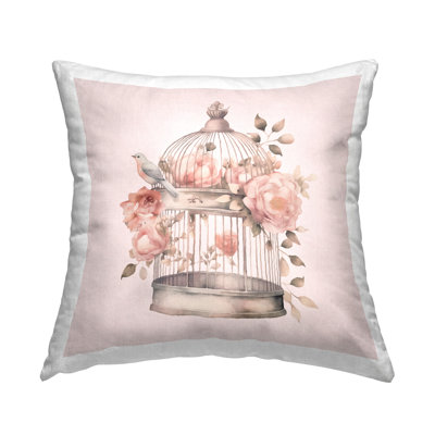 Coussin décoratif avec cage à oiseaux et fleurs roses, design par Andrea Haase