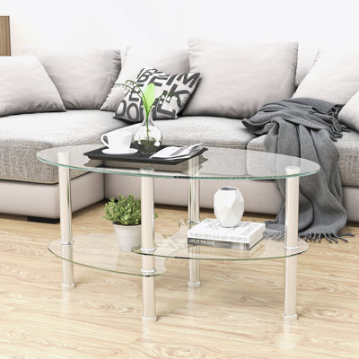 Table basse ovale avec plateau en verre et tablette