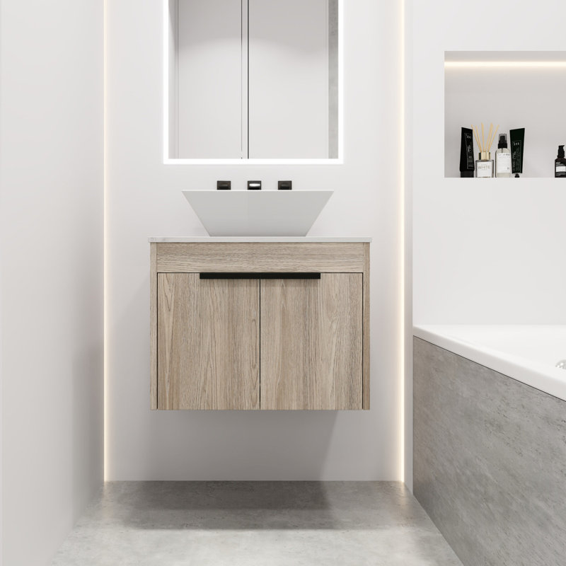Meuble-lavabo moderne de 24 po. Chêne blanc avec lavabo en céramique. Porte à fermeture en douceur pour un lavabo de moment de détente. Fixé au mur. Expérience silencieuse