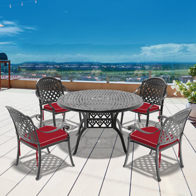  Akiesha Patio Dining Set with Round Table , Red Cushions Included