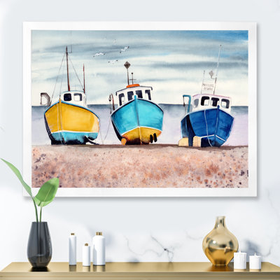 " Three Colorful Fishing Boats On A Sandy Seashore "