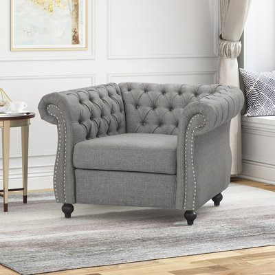 Fauteuil club capitonné