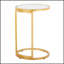 Table de bout ronde en métal doré avec plateau en verre transparent Zenn, parfaite pour les espaces de vie modernes et élégants