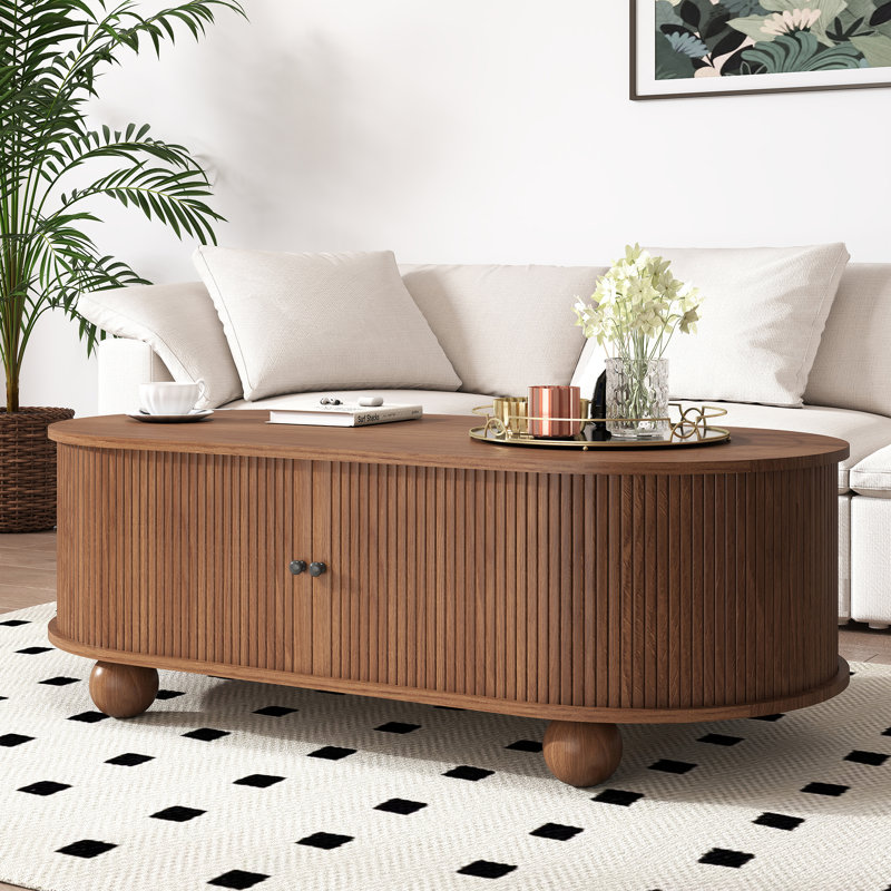 Table basse ovale avec portes coulissantes, table basse moderne cannelée de style Mid-Century avec rangement caché pour le salon, noyer