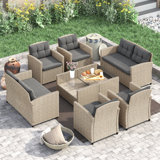 Jett 8 - Person Wicker / Rattan Outdoor Sofa Seating Group with  Glass-Top Shelf-Storage Table & Cushions