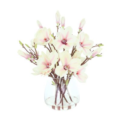Arrangement floral Kora Magnolia dans un vase en verre