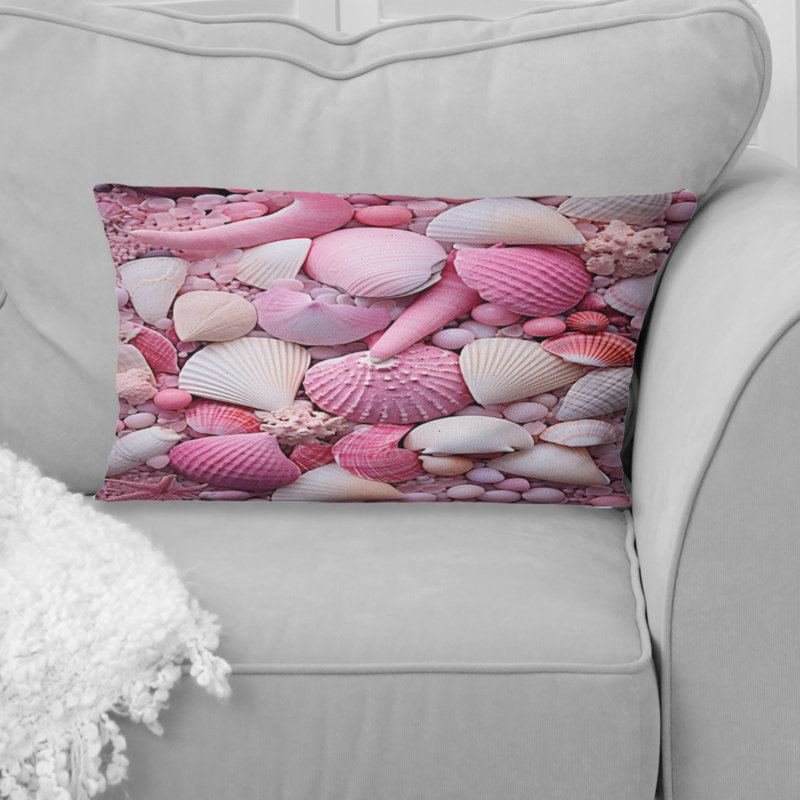 Coussin rose à imprimé coquillage rose sur la plage