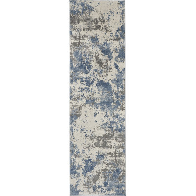 Tapis abstrait gris tissé à la machine