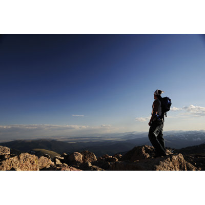 Man On Top Of A Mountain by Chris Stein - No Frame Art Prints on Canvas