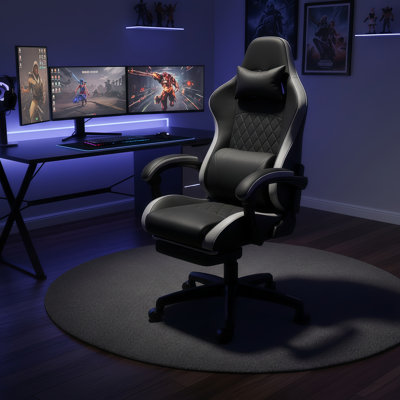 Fauteuil ergonomique noir à haut dossier, idéal pour les jeux et le travail au bureau, avec siège à ressorts ensachés individuellement, accoudoirs liés, repose-pieds et soutien lombaire.
