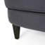 Fauteuil club classique avec siège en tissu gris, structure stable avec pieds en bouleau