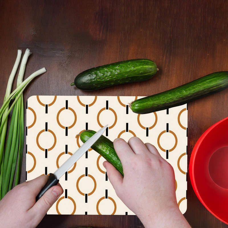 Motif géométrique abstrait moderne sur une planche à découper en verre, idéal pour les ustensiles de cuisine élégants et les besoins de service