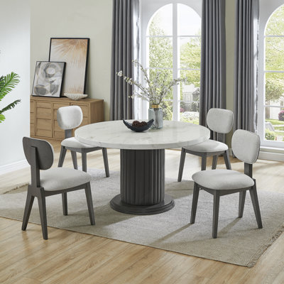 Ensemble de salle à manger 5 pièces rond en faux marbre avec chaises rembourrées et base piédestal pour les espaces de salle à manger modernes.