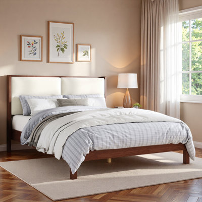 Lit plateforme en bois avec tête de lit tapissier en velours