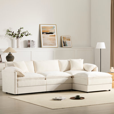 Canapé d'angle en chenille de 262 cm avec coussins doubles, assise spacieuse et structure pour un confort optimal en appartement. Coussins décoratifs pour accoudoirs. Dimensions de la maison et du salon.
