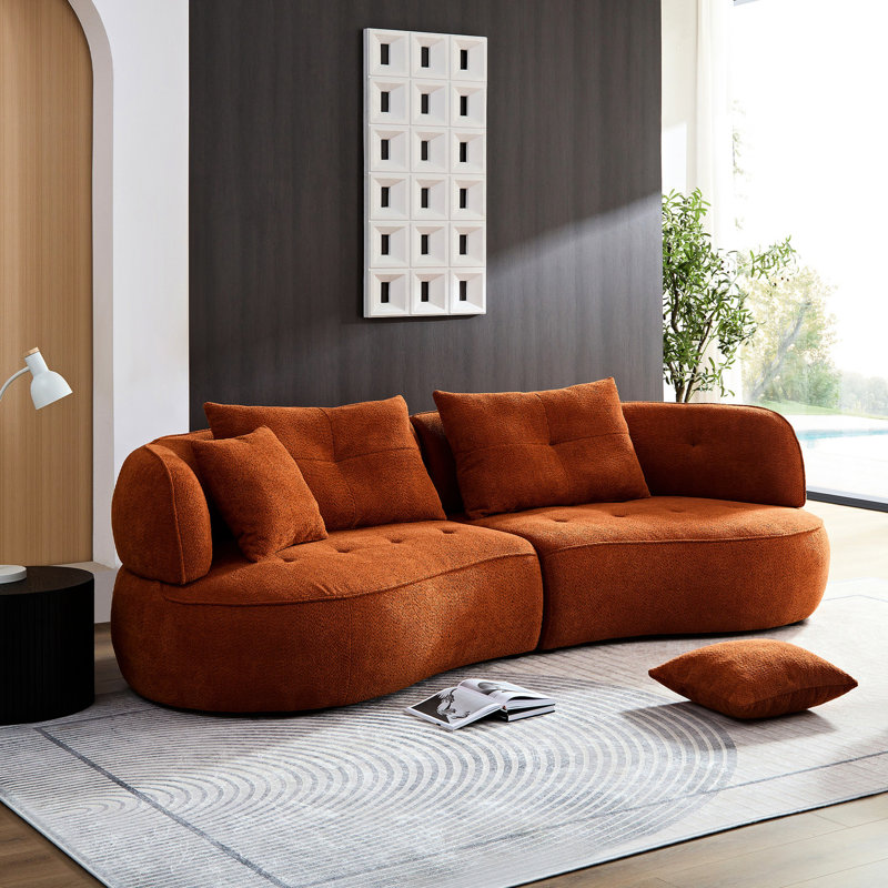 Élégant salon orange avec détails de sièges confortables modulaires et arrondis en tissu