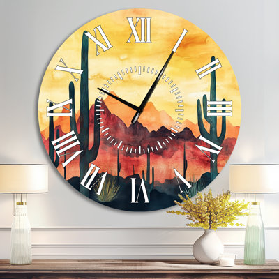 Horloge murale ronde en métal de style sud-ouest américain, représentant des montagnes désertiques et des silhouettes de cactus.
