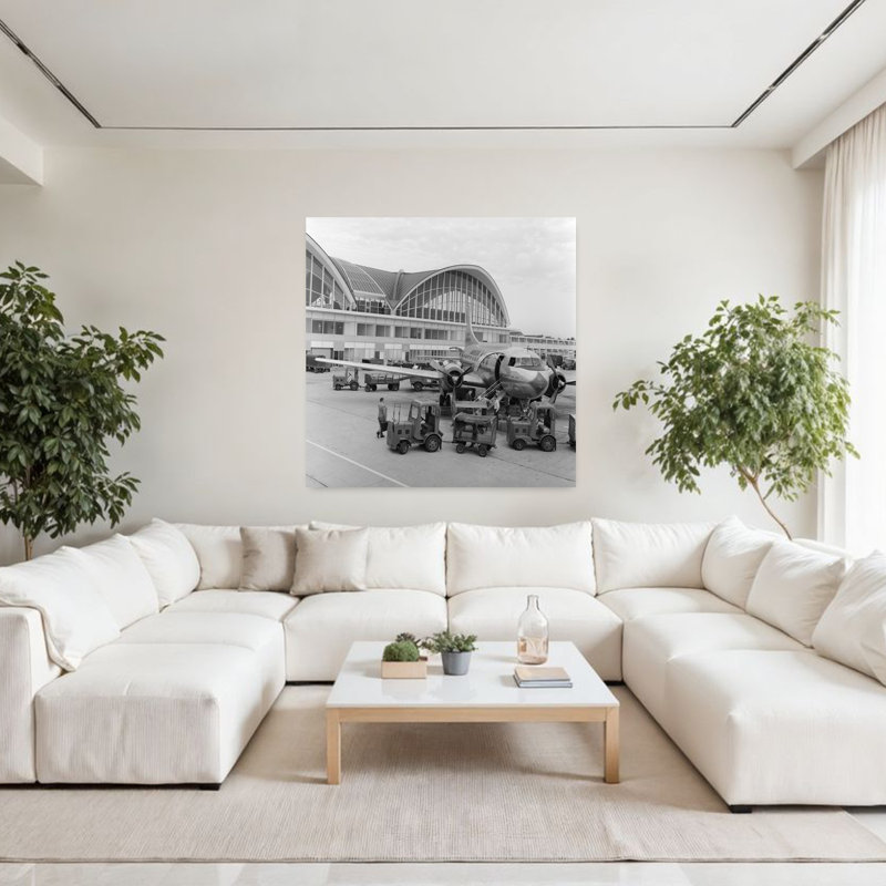 1950s 1960s PROPELLER AIRPLANE ON AIRPORT TARMAC IN FRONT OF TERMINAL WITH MODERN ARCHED WINDOWS ST. LOUIS MISSOURI USA by C. S. Bauer - Wrapped Canvas Print
