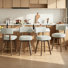 Tabouret de bar pivotant rembourré avec structure en bois massif et repose-pieds plaqué or