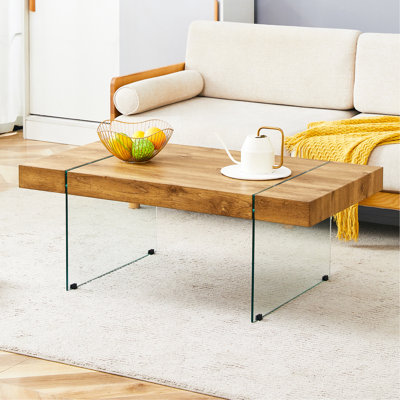 Table basse 43,3 po x 23,6 po en bois aggloméré texturé avec pieds en verre trempé. Convient au salon. Elle peut être utilisée non seulement comme table basse, mais aussi comme table d'appoint ou présentoir.