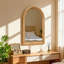 Miroir mural encadré de bois arqué