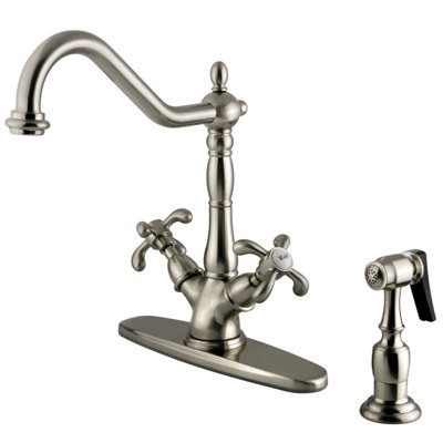 Kingston Brass French Country Two-Handle 2-or-4 Hole Deck Mount Kitchen Faucet with Brass Sprayer