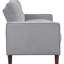 Canapé compact gris rembourré, silhouette classique et pieds fuselés, idéal pour les petits appartements. Accoudoirs et dossier carrés, confort optimal.