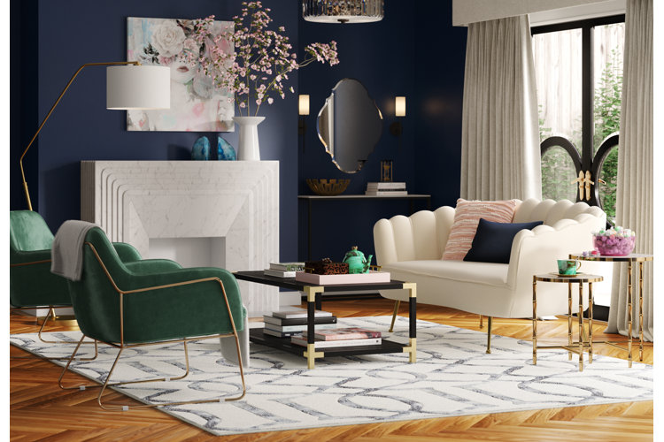 Modern glam living room with a navy blue accent wall.