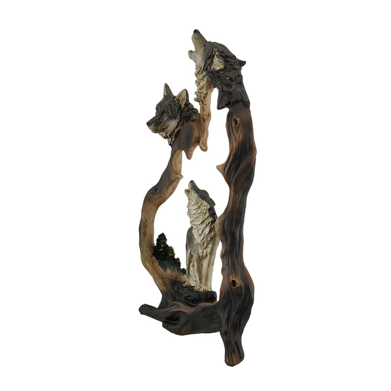 Statue découpée de loups hurlants