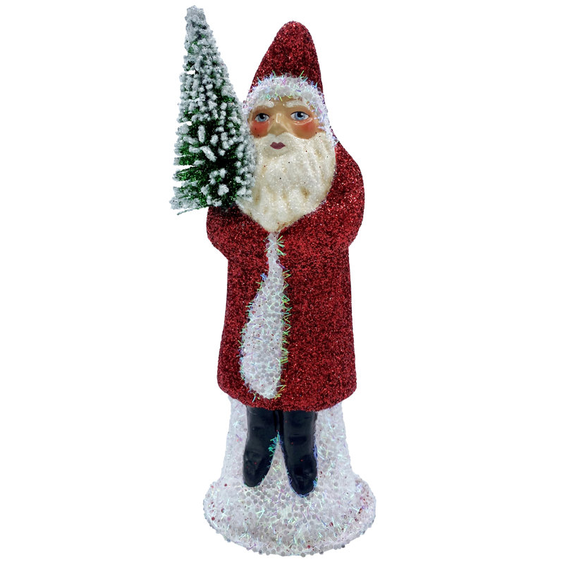 Père Noël en manteau scintillant avec arbre
