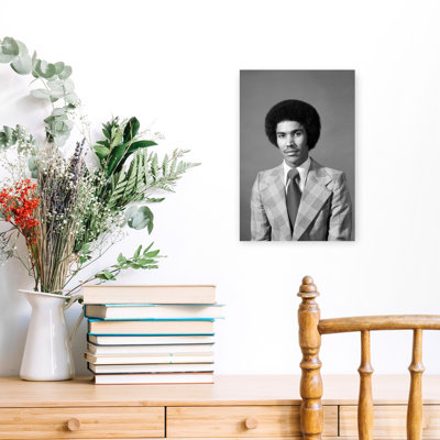1970S Serious African American Man Portrait With Afro Hair Style Looking At Camera Wearing Plaid Jacket With Very Wide Lapels Classic Retro Vintage...