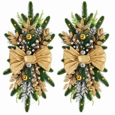 Ensemble de 2 guirlandes lumineuses artificielles en forme de larme pour porte d'entrée, avec nœud doré, feuilles métalliques et boules décoratives. Décoration hivernale pour murs, fenêtres et porches.