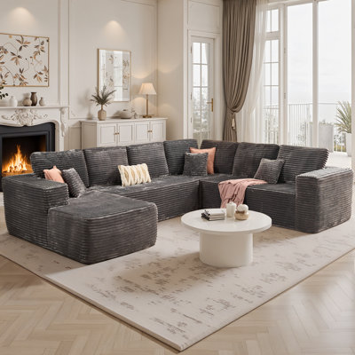 Canapé modulaire avec assise profonde en tissu de velours côtelé Cloudelle