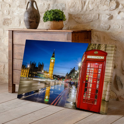 Canvas A Vibrant Nighttime Scene In London Featuring A Classic Red Wall Art Telephone Booth Prominently In The Foreground Its Glossy Canvas Wall Art