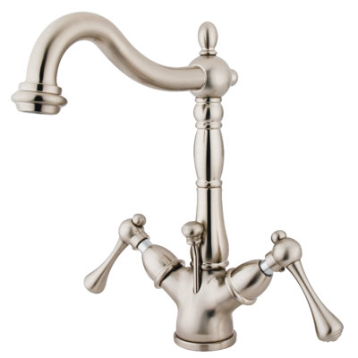 Kingston Brass Heritage Two-Handle 1-or-3 Hole Deck Mount Bathroom Faucet with Brass Pop-Up